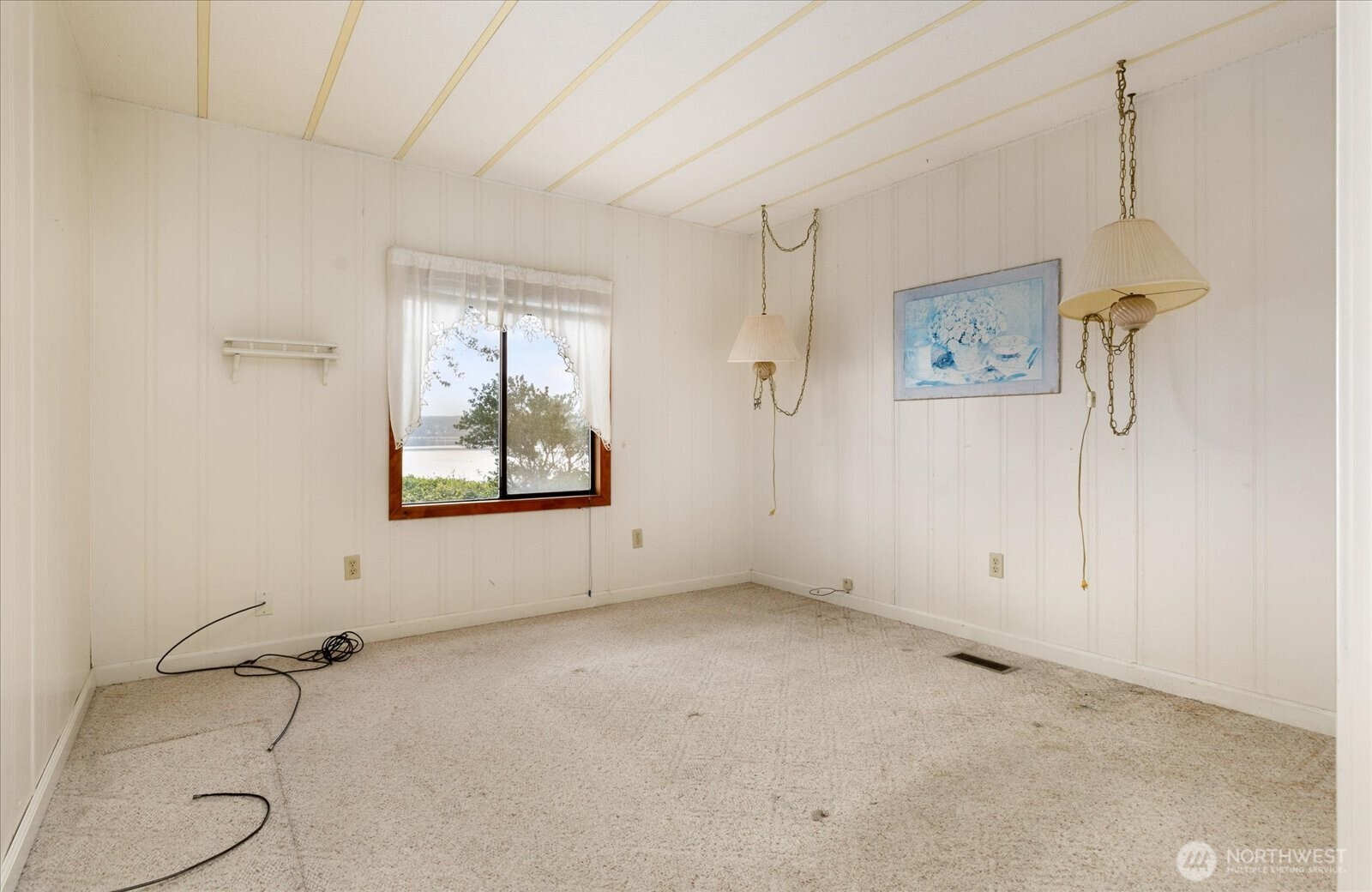 1677 Penn Cove Road Oak Harbor, WA 98277 - Photo 17 of 40 a view of an empty room with a window