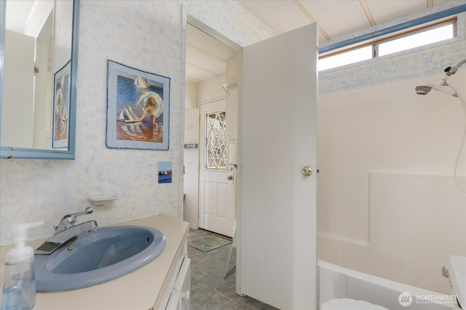 1677 Penn Cove Road Oak Harbor, WA 98277 - Photo 25 of 40 a bathroom with a sink and a mirror