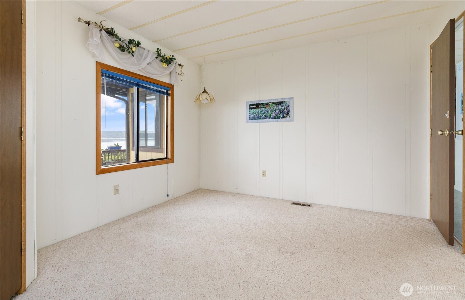 1677 Penn Cove Road Oak Harbor, WA 98277 - Photo 29 of 40 an empty room with windows and closet
