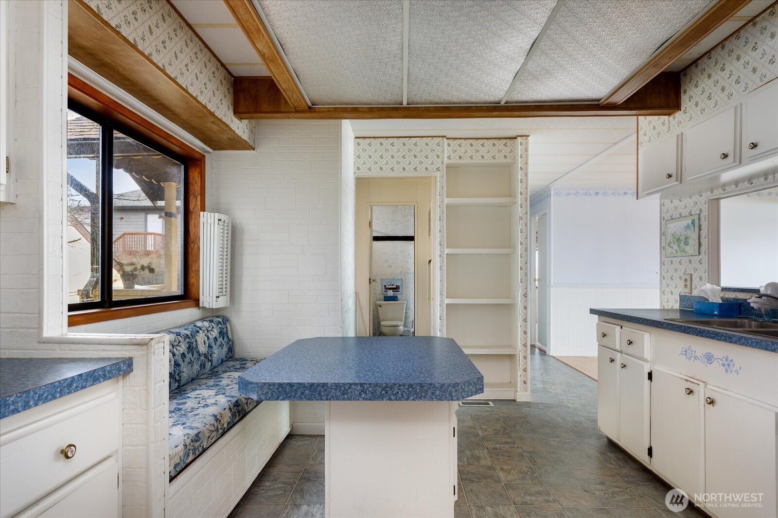 1677 Penn Cove Road Oak Harbor, WA 98277 - Photo 30 of 40 a bathroom with a granite countertop sink and a mirror