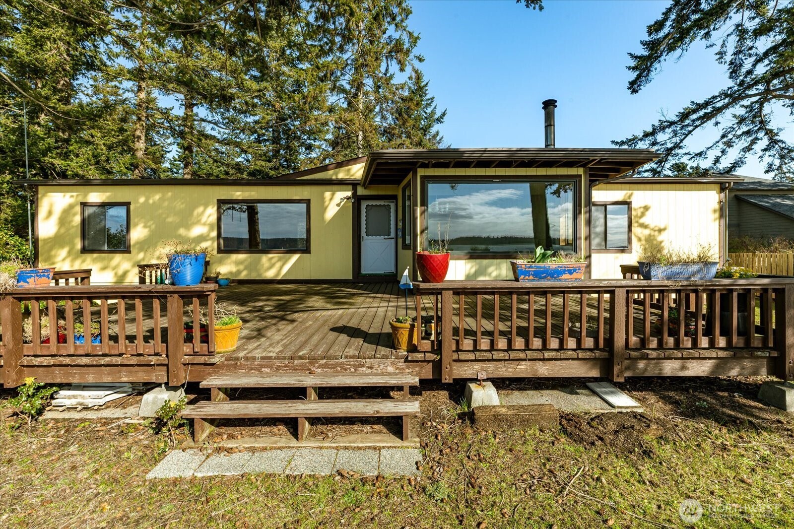1677 Penn Cove Road Oak Harbor, WA 98277 - Photo 5 of 40 a front view of a house with swimming pool