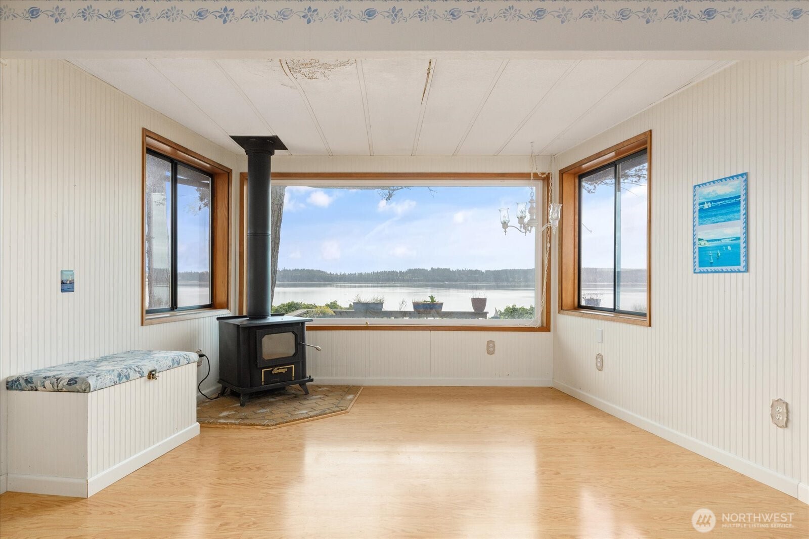 1677 Penn Cove Road Oak Harbor, WA 98277 - Photo 9 of 40 a large white kitchen with a large window