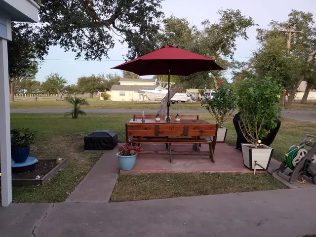 a view of a backyard with sitting area and furniture