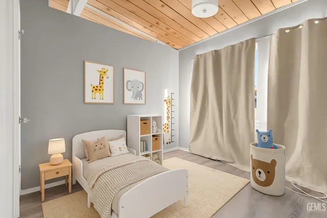 a bed room with a bed and a chair