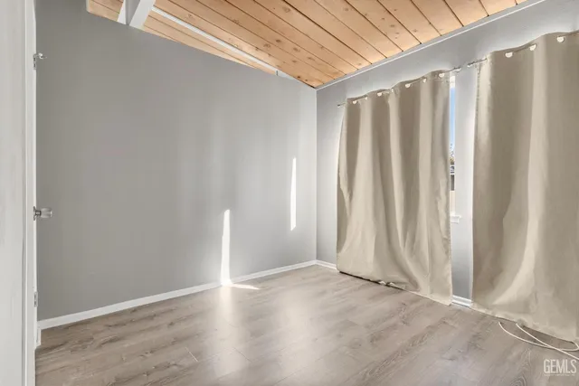 a view of a garage with wooden floor