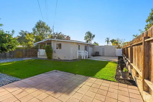 a view of a back yard of the house