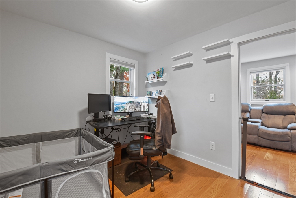38 Twichell Street Athol, MA 01331 - Photo 14 of 26 a view of a workspace with furniture and a window