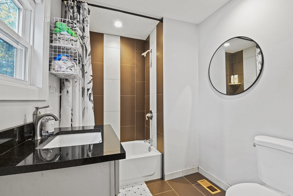 38 Twichell Street Athol, MA 01331 - Photo 16 of 26 a bathroom with a sink and a mirror