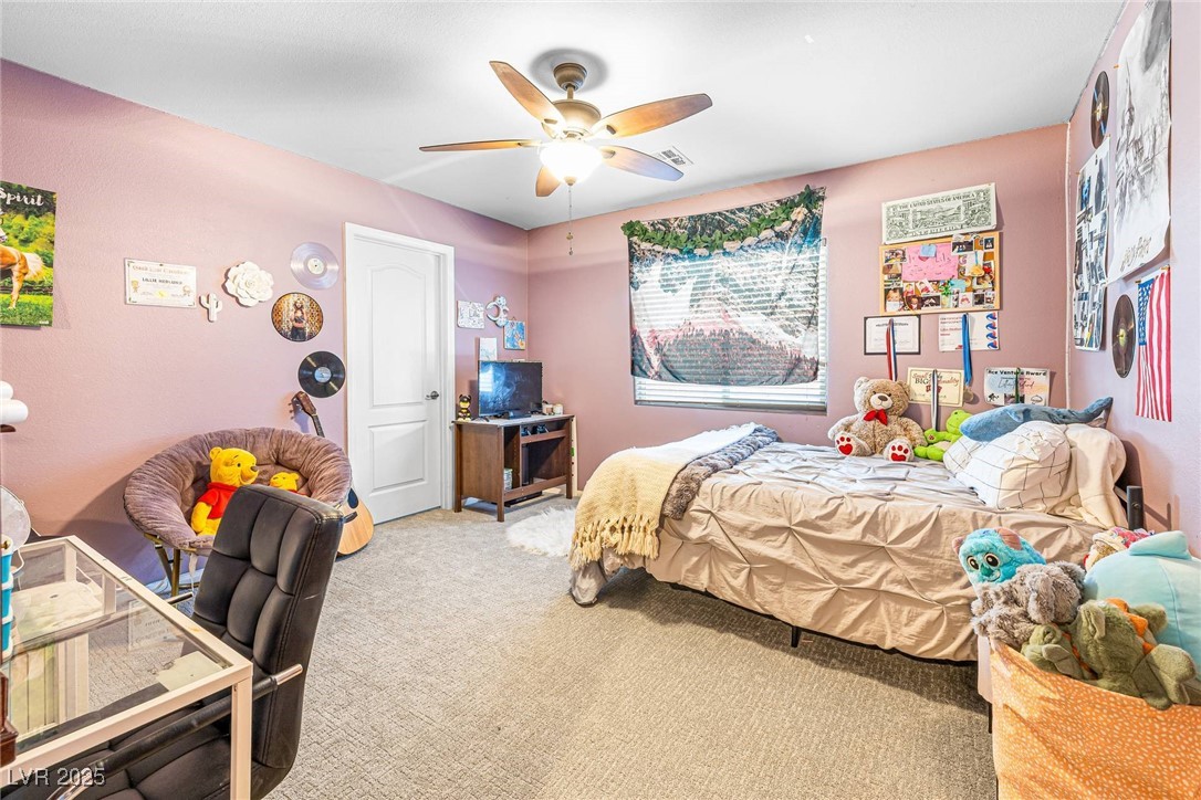 10523 Laurel Mountain Lane Las Vegas, NV 89166 - Photo 19 of 36 5th Bedroom featuring light carpet and ceiling fan