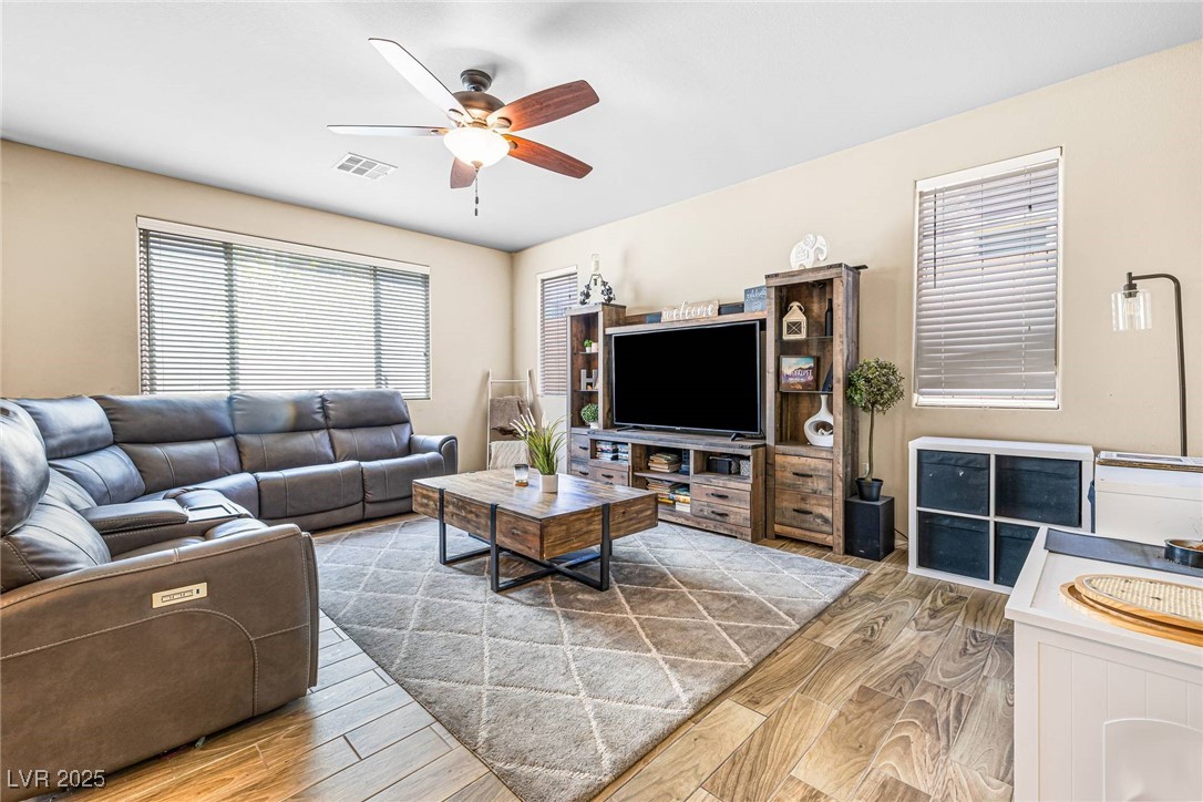 10523 Laurel Mountain Lane Las Vegas, NV 89166 - Photo 9 of 36 Family room with wood finished floors and a ceiling fan