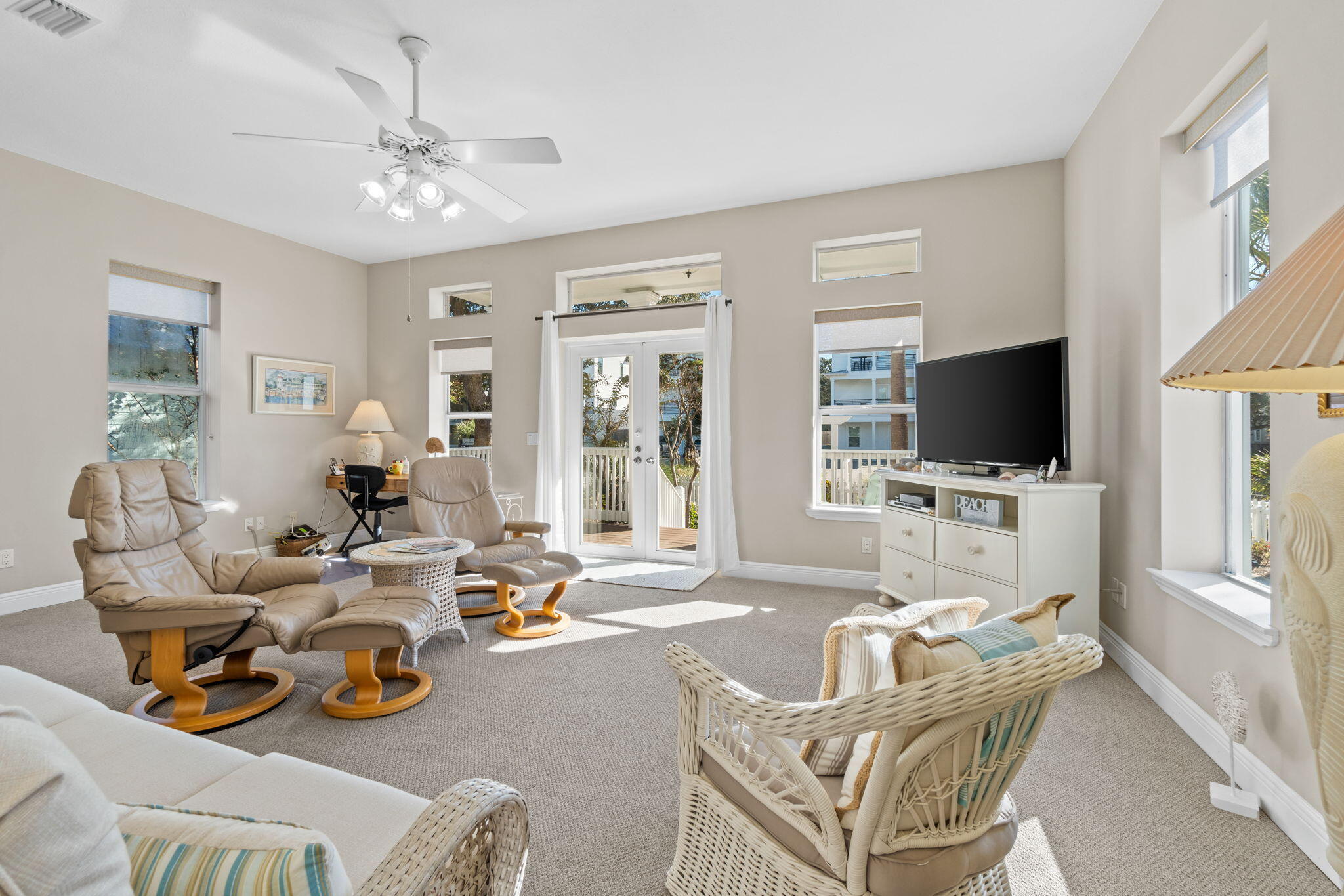 80 Dolphin Street Destin, FL 32541 - Photo 11 of 34 a living room with furniture and a flat screen tv