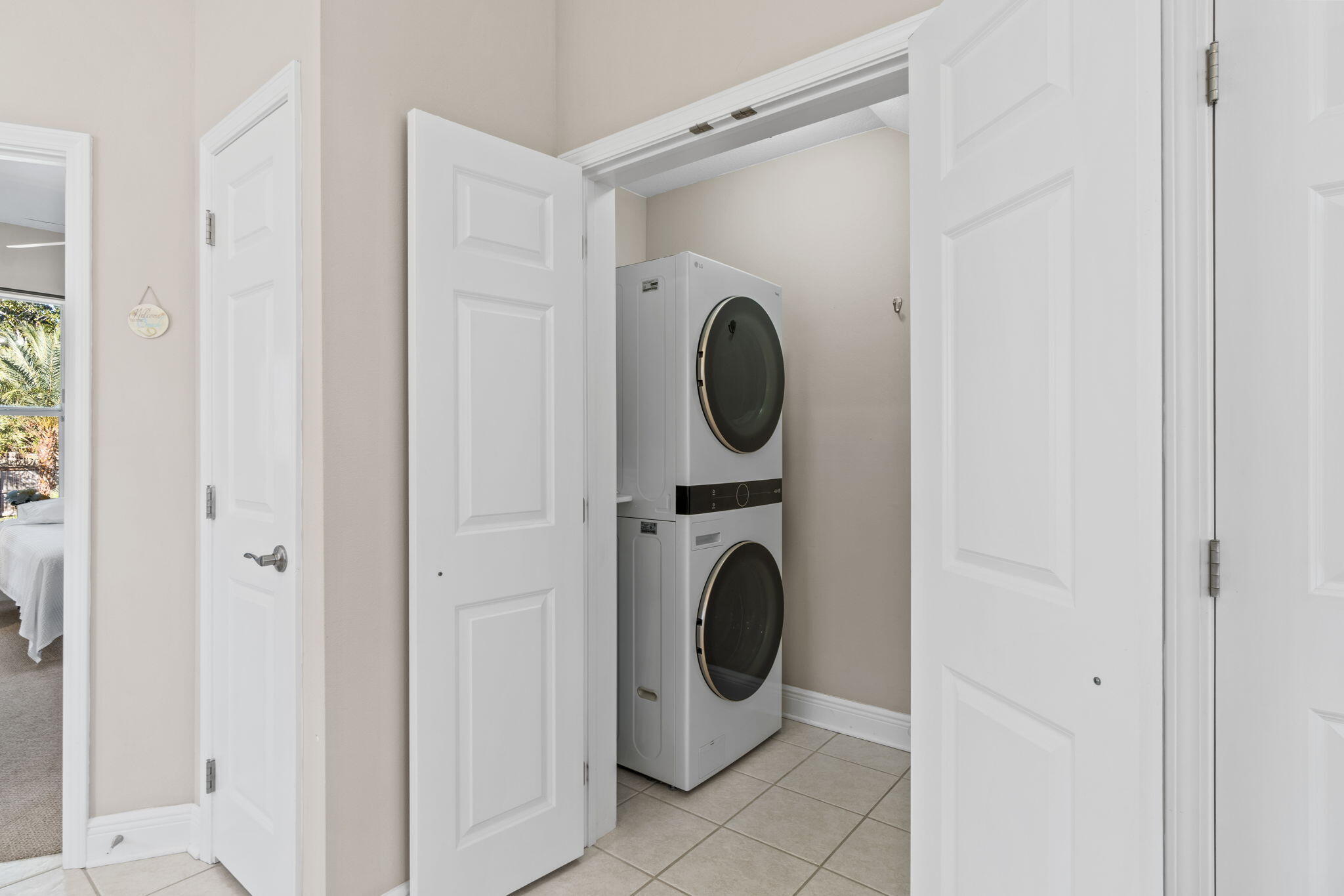 80 Dolphin Street Destin, FL 32541 - Photo 15 of 34 a close view of a bathroom with a washer and dryer