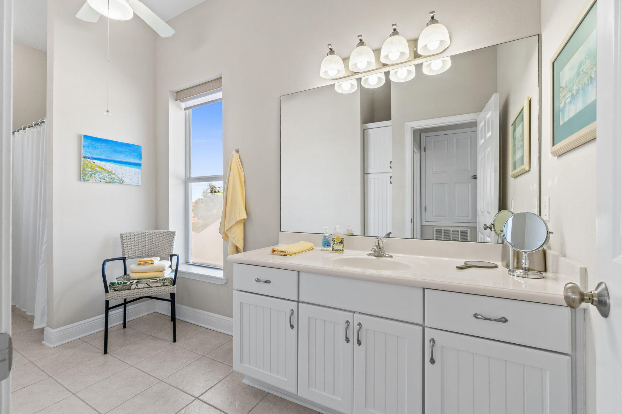 80 Dolphin Street Destin, FL 32541 - Photo 18 of 34 a bathroom with a double vanity sink and a mirror