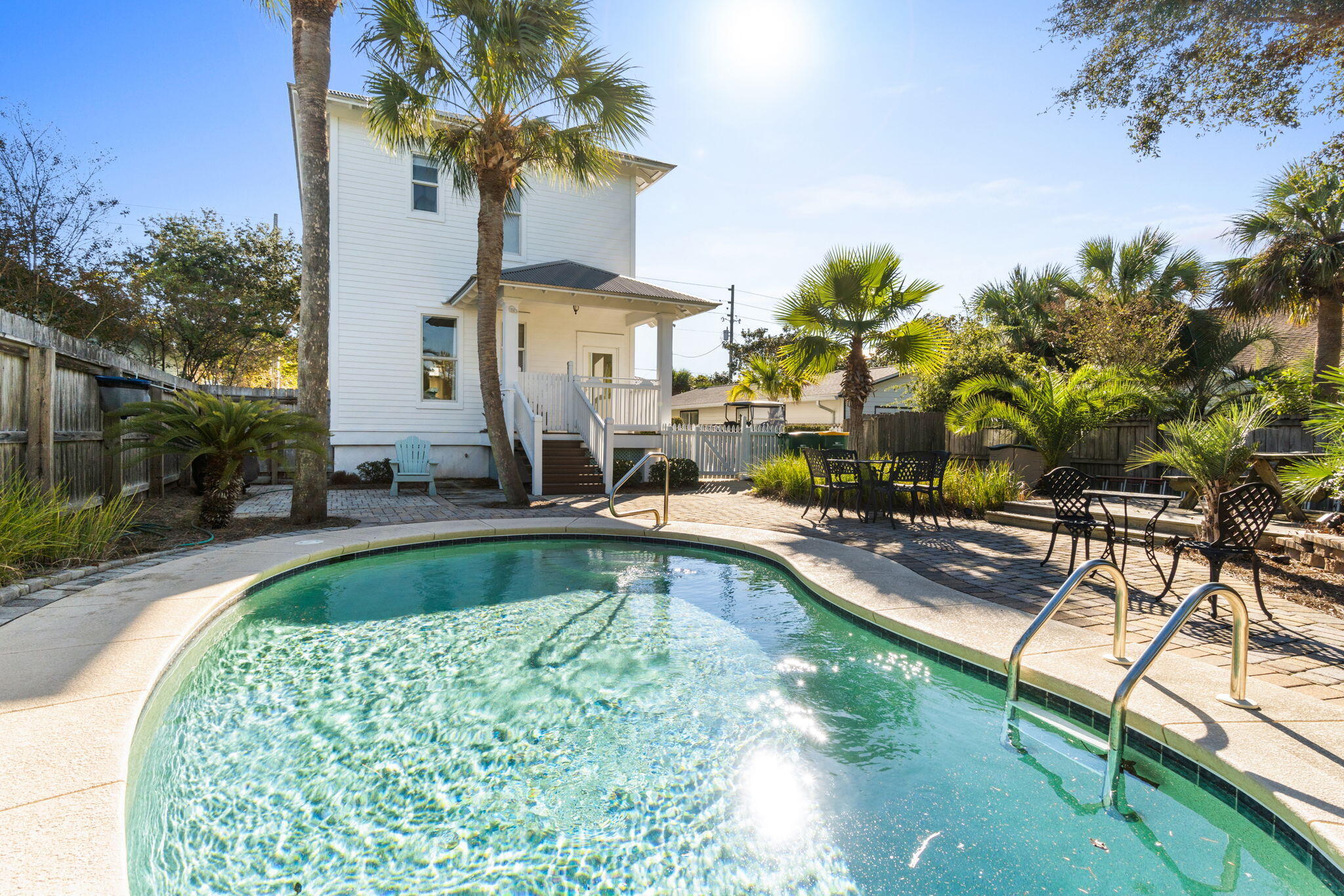 80 Dolphin Street Destin, FL 32541 - Photo 2 of 34 a view of a swimming pool with a patio