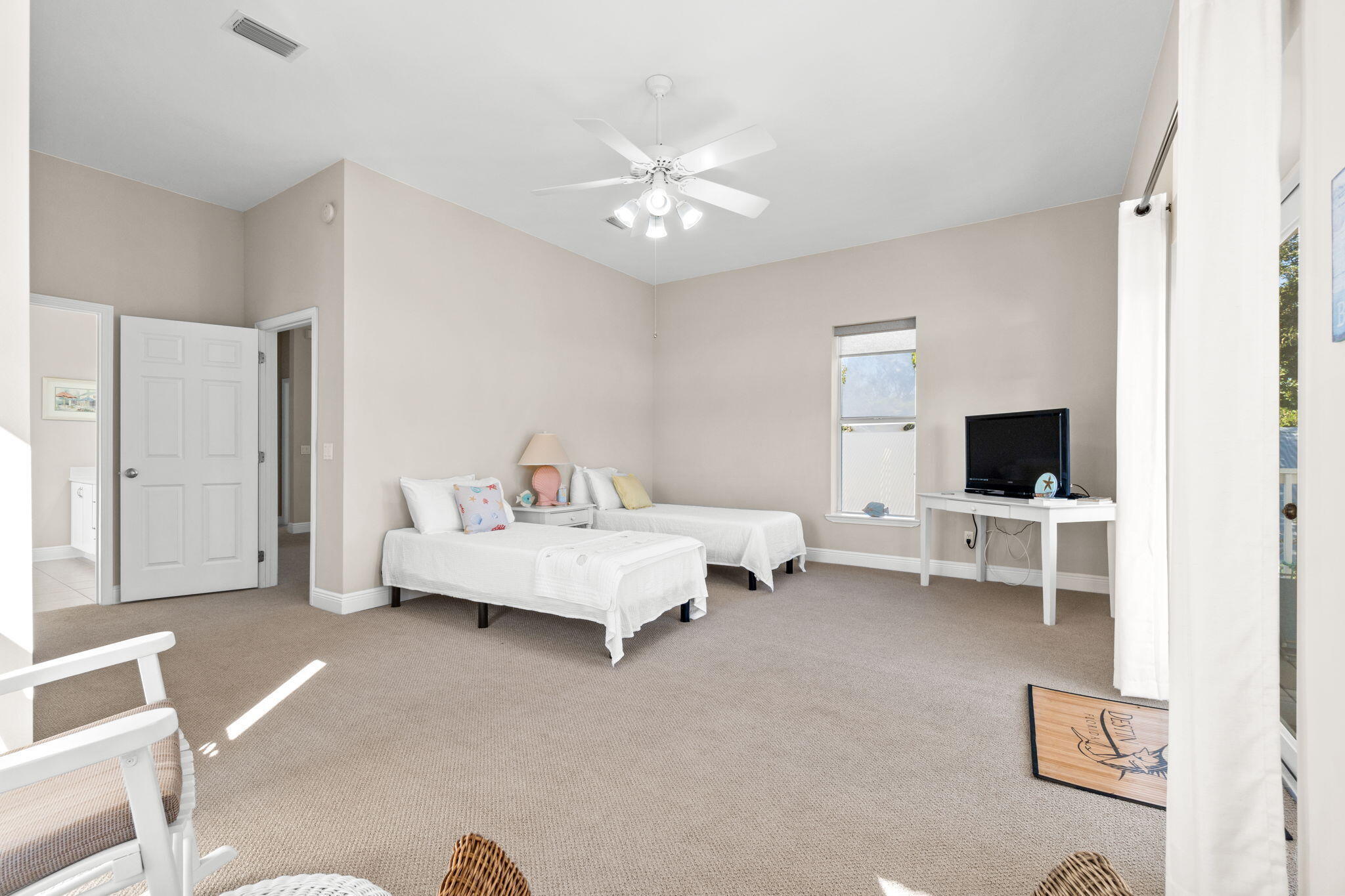 80 Dolphin Street Destin, FL 32541 - Photo 22 of 34 a living room with furniture and a flat screen tv