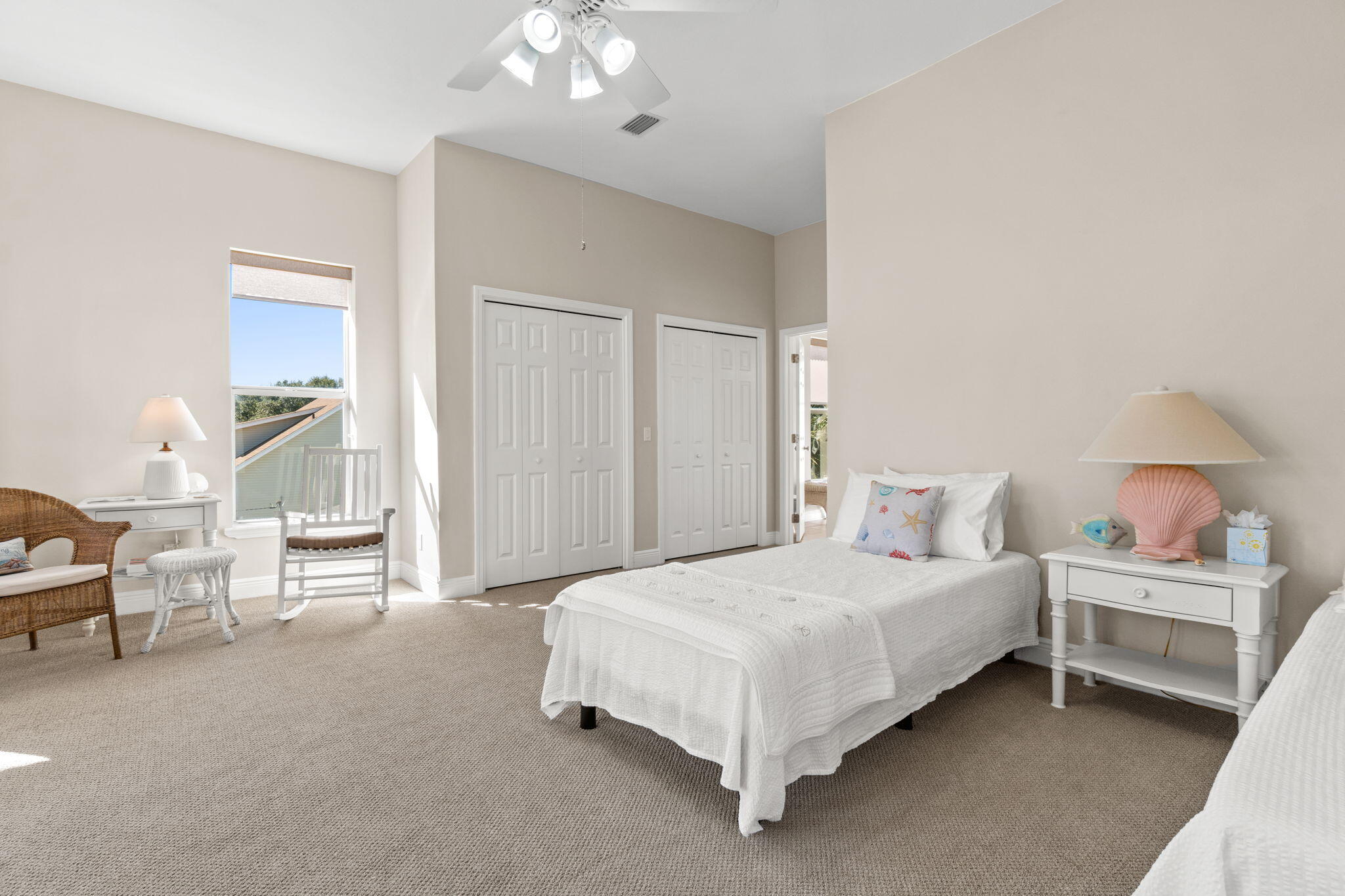 80 Dolphin Street Destin, FL 32541 - Photo 23 of 34 a bedroom with a bed and a chandelier