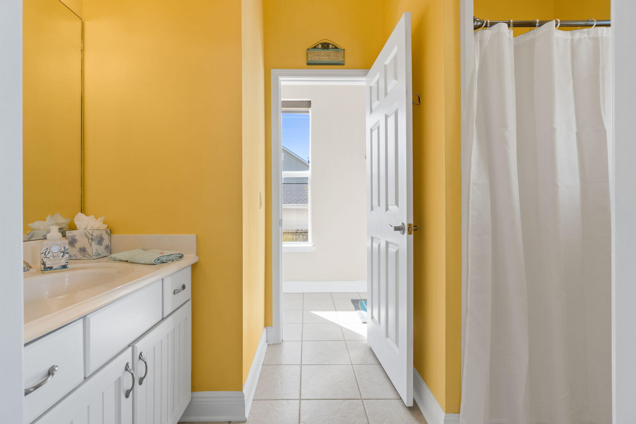 80 Dolphin Street Destin, FL 32541 - Photo 26 of 34 a bathroom with a granite countertop sink and a mirror