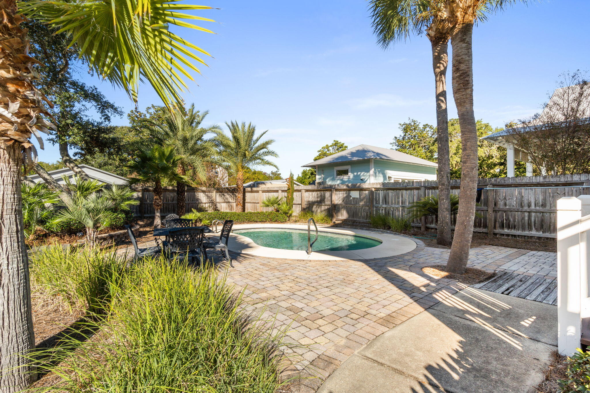 80 Dolphin Street Destin, FL 32541 - Photo 32 of 34 a view of a swimming pool with a patio