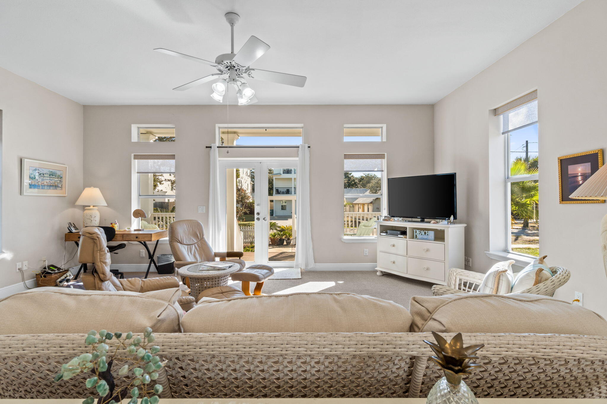 80 Dolphin Street Destin, FL 32541 - Photo 4 of 34 a living room with furniture and a flat screen tv