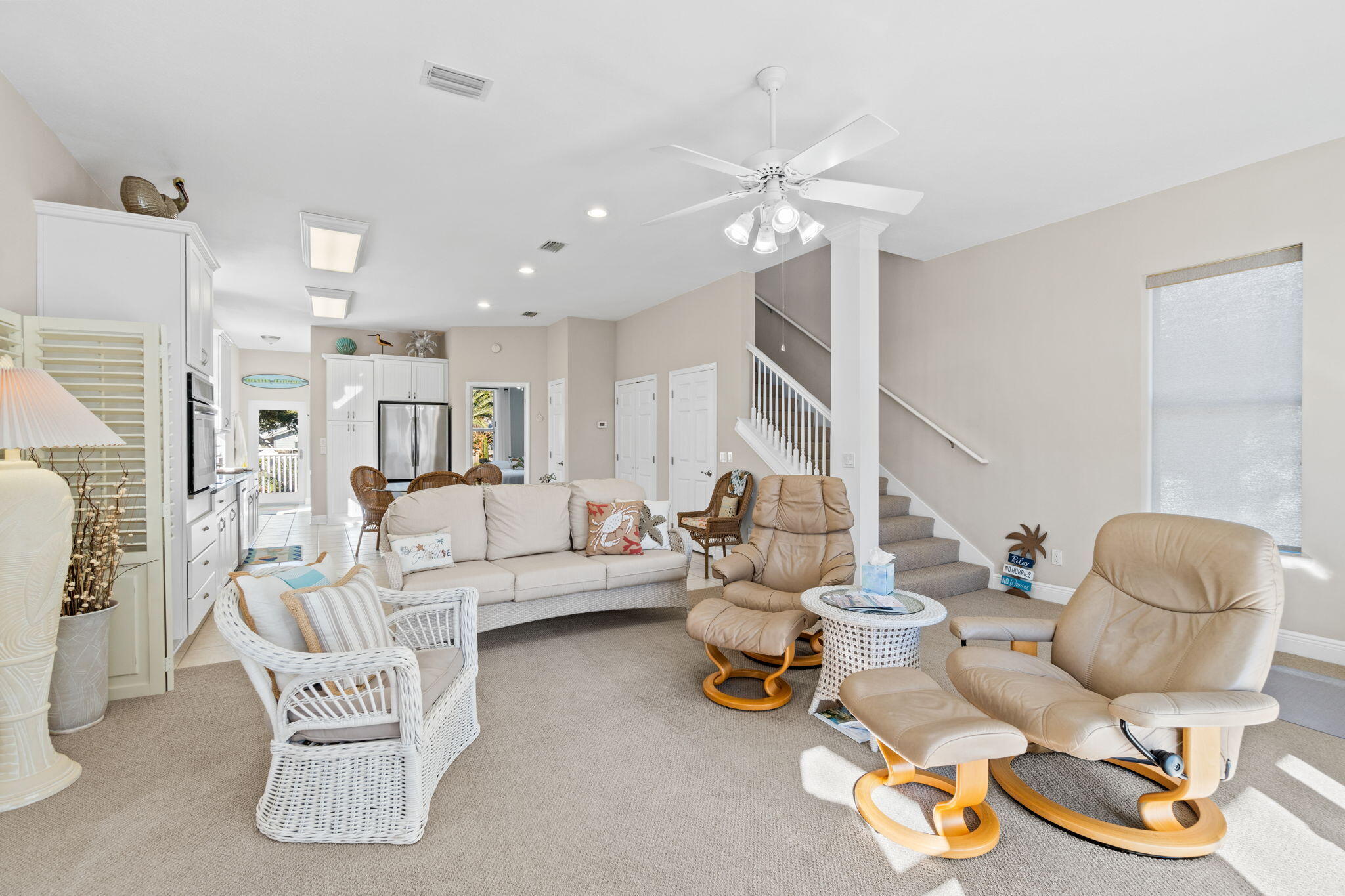 80 Dolphin Street Destin, FL 32541 - Photo 6 of 34 a living room with furniture and a chandelier