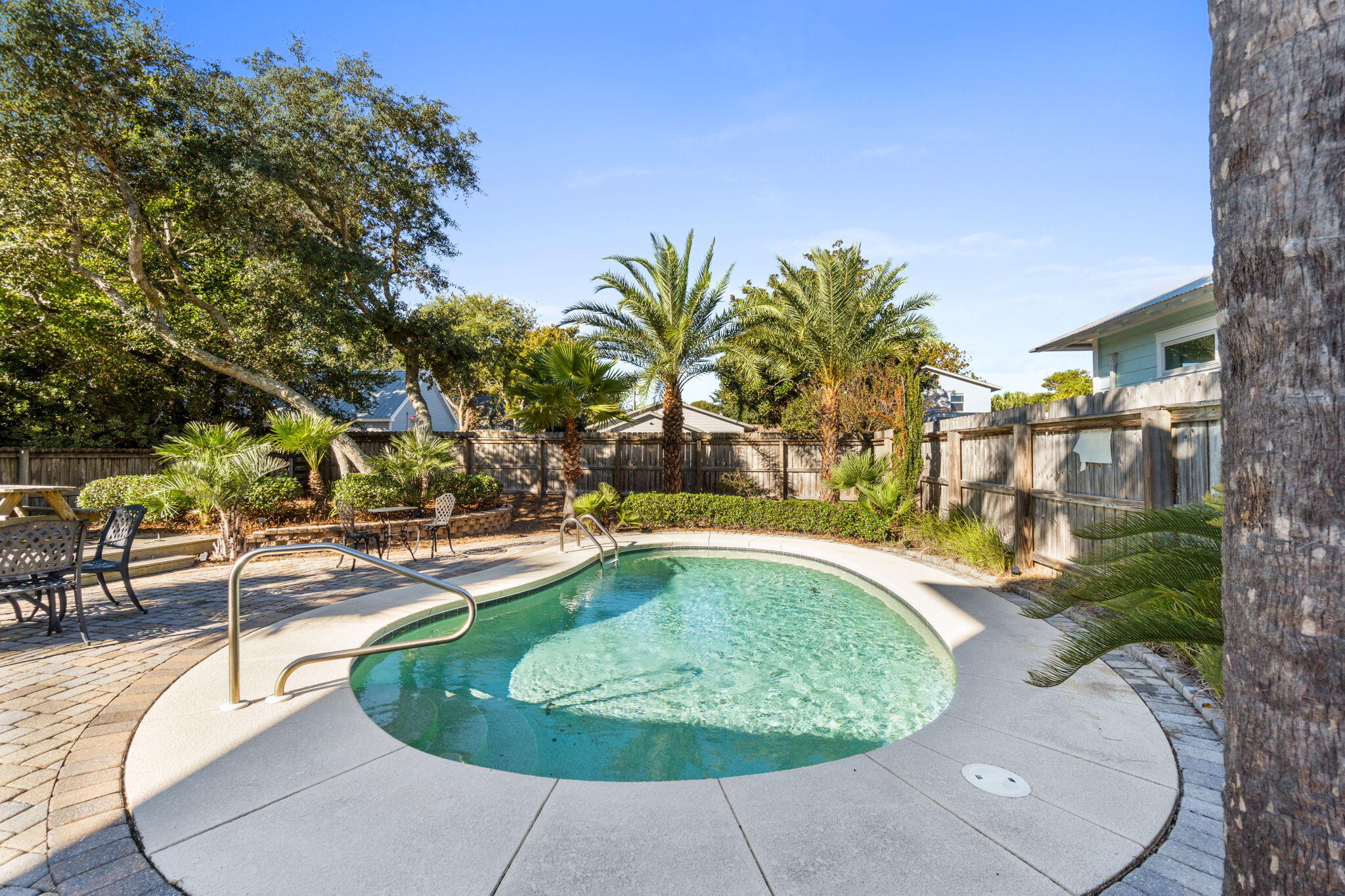 80 Dolphin Street Destin, FL 32541 - Photo 8 of 34 a swimming pool with outdoor seating and yard