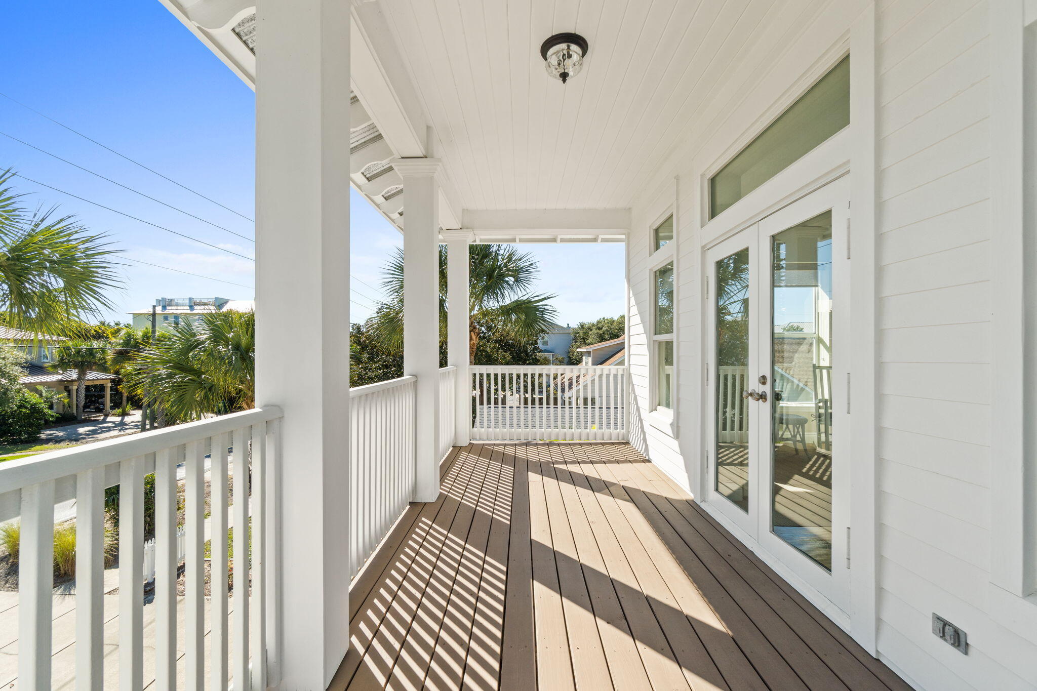 80 Dolphin Street Destin, FL 32541 - Photo 9 of 34 a view of a balcony with wooden floor