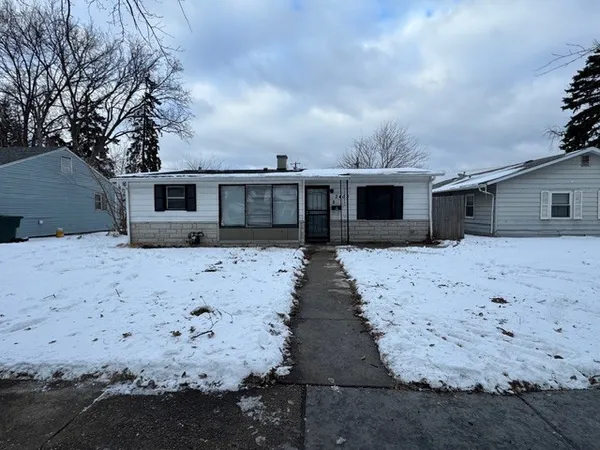 a front view of a house with yard