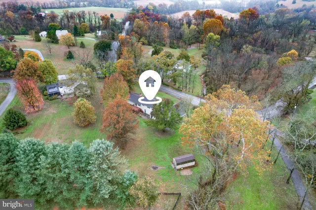 an aerial view of residential house with outdoor space
