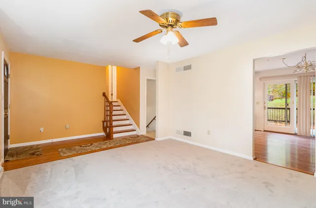a kitchen with a sink refrigerator and cabinets