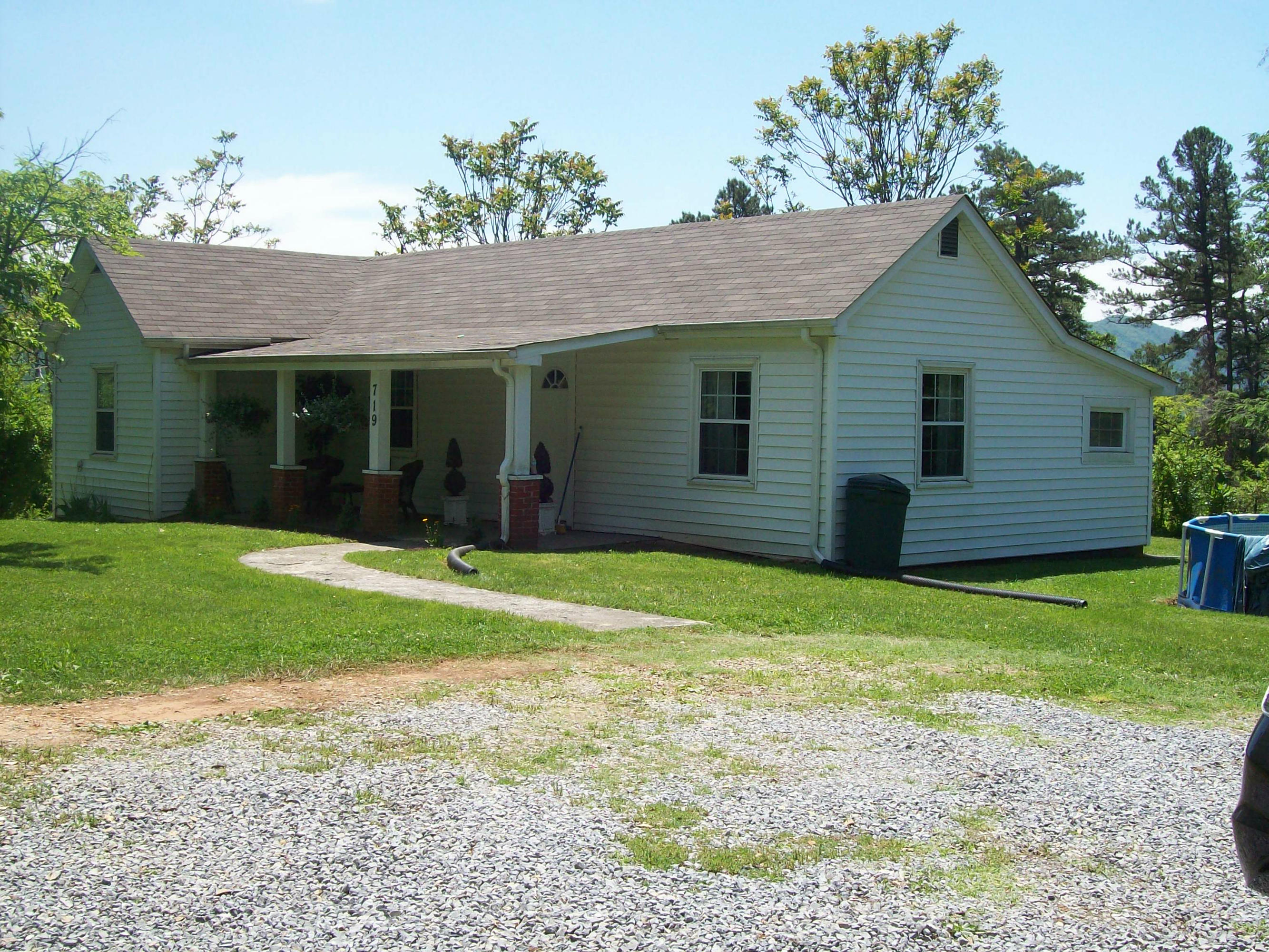 a view of a house with garden and yard