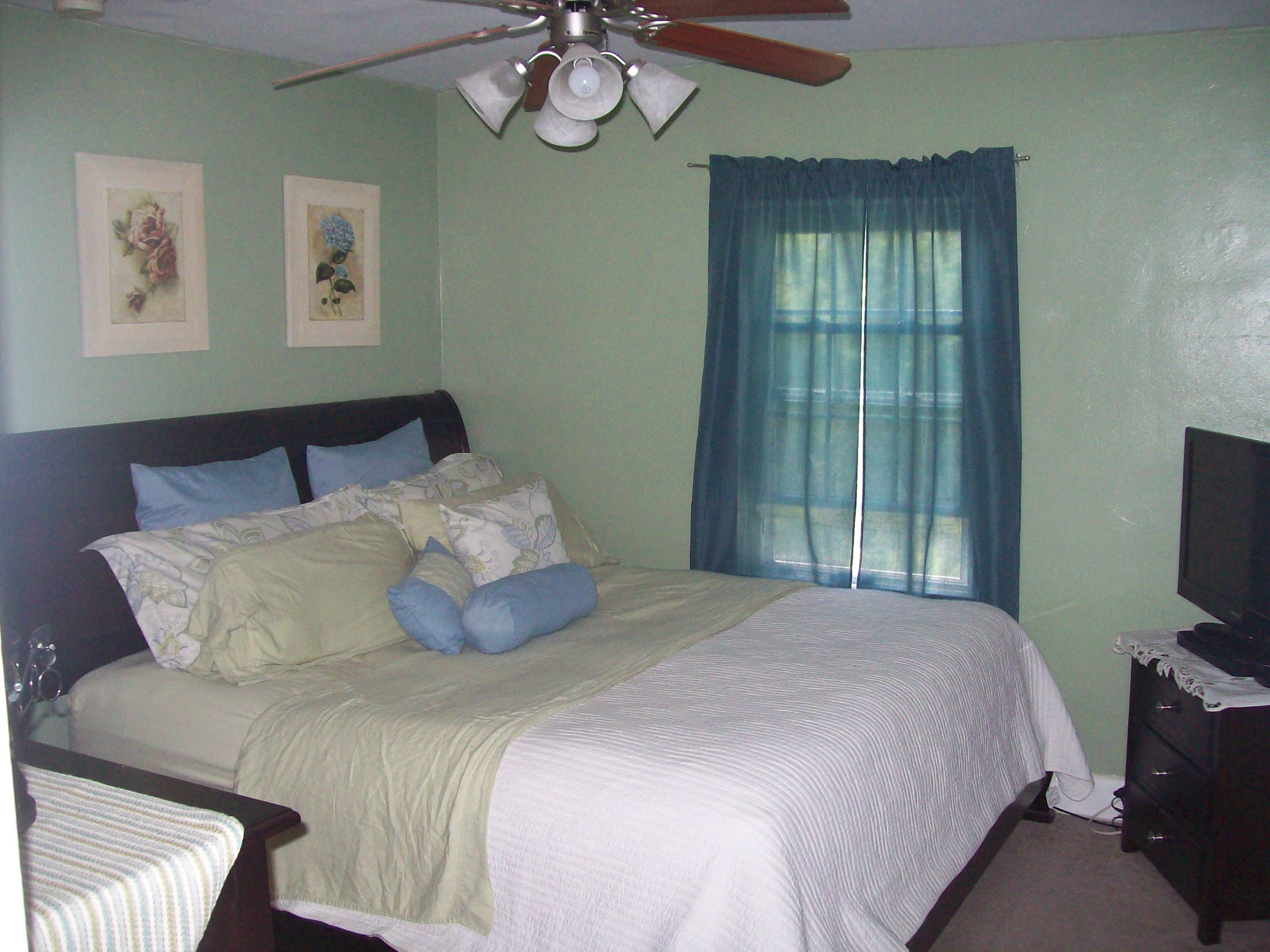 719 Colonial Road Blue Ridge, VA 24064 - Photo 5 of 6 a bedroom with a bed and a tv