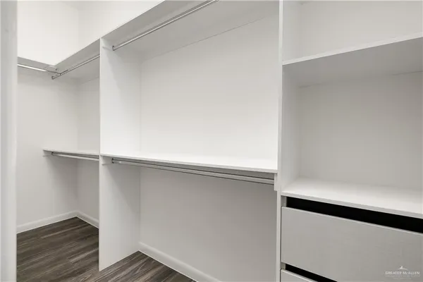 a view of an empty walk in closet