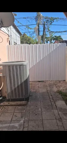 a utility room with cabinets washer and dryer