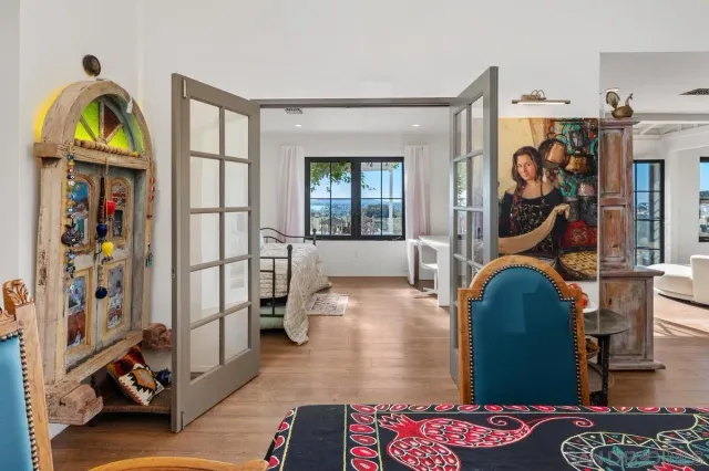 a bedroom with furniture and a window