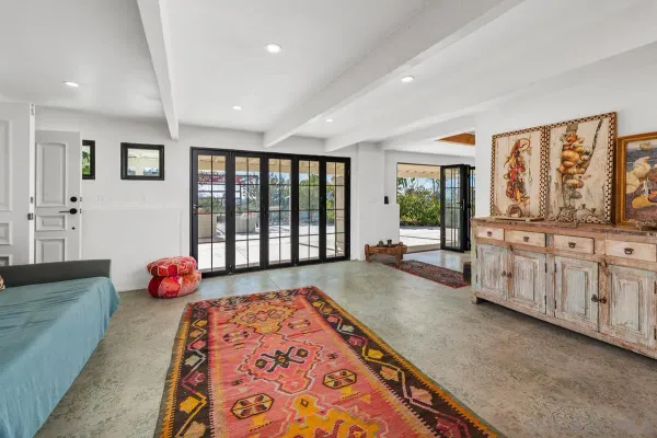 a view of a porch with potted plants