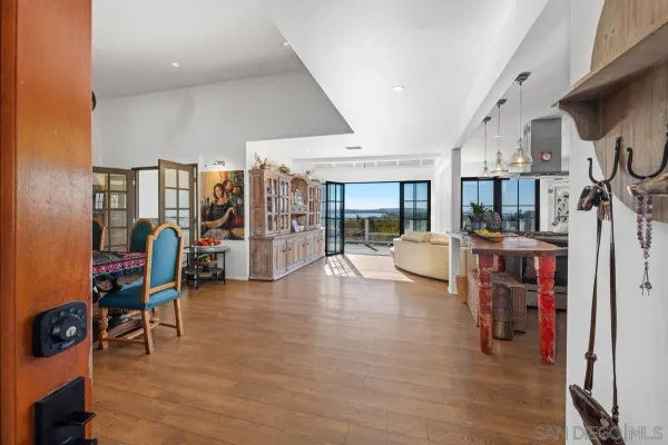 a view of living room filled with furniture and window