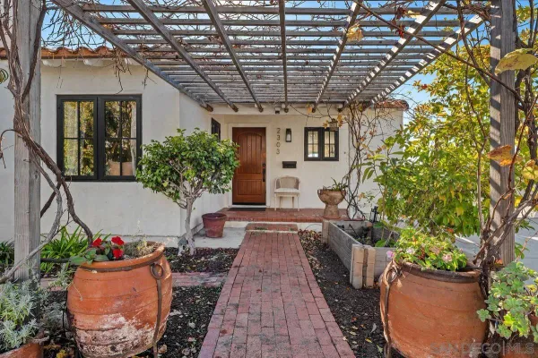 a view of a backyard with wooden fence