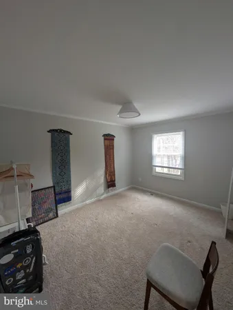 a view of a livingroom with furniture and a window