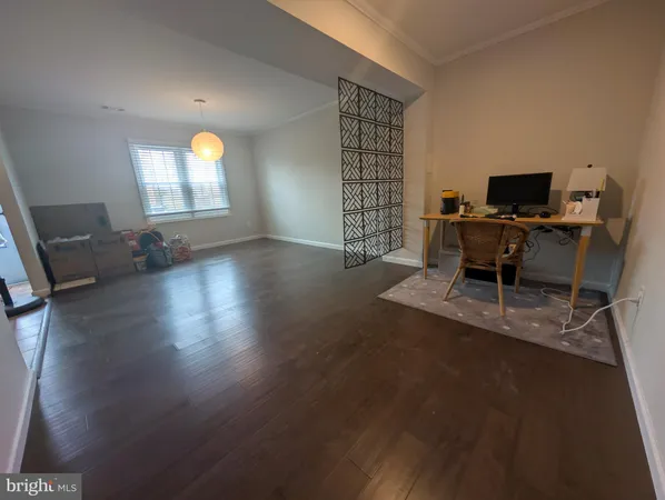 a view of a livingroom with furniture and a window