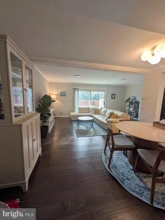 a room with furniture pool table and windows
