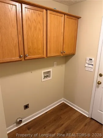 a view of room with window and hardwood