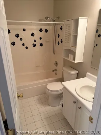 a bathroom with a toilet sink and shower