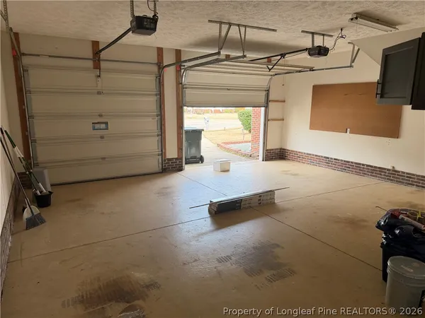 a view of a street with a large tree