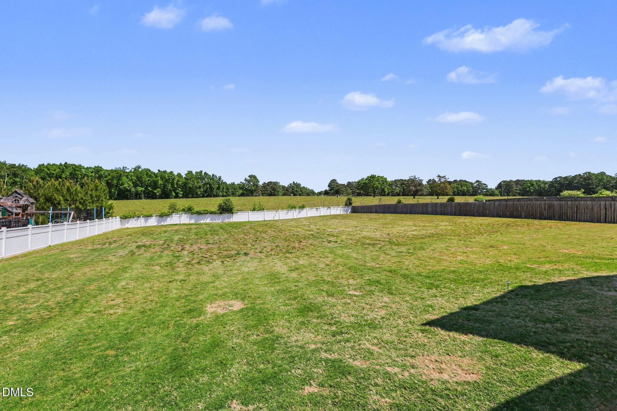 432 Seabring Lane Raleigh, NC 27603 - Photo 26 of 29 a view of a lake with houses in the back