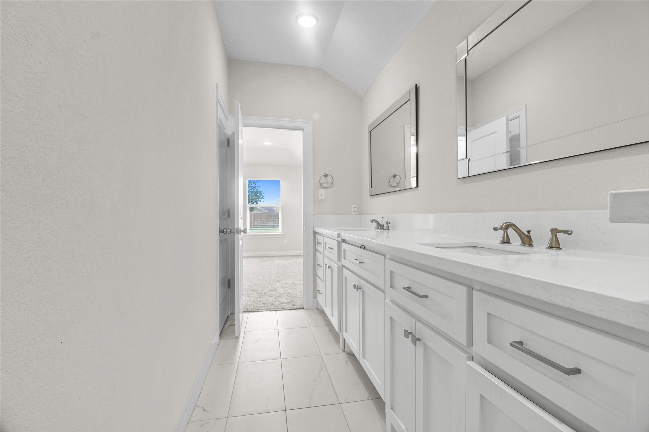 1208 East Henderson Road Angleton, TX 77515 - Photo 14 of 29 a spacious bathroom with a granite countertop sink and a mirror