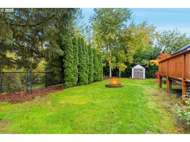 a view of a backyard with swimming pool