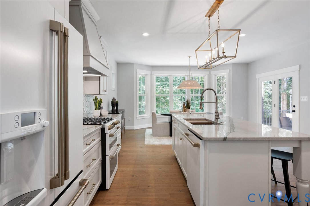 13800 Summerlook Lane Chesterfield, VA 23832 - Photo 15 of 49 a kitchen with stainless steel appliances a stove sink and refrigerator