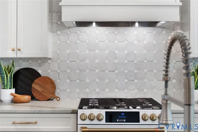 a stove top oven sitting inside of a kitchen