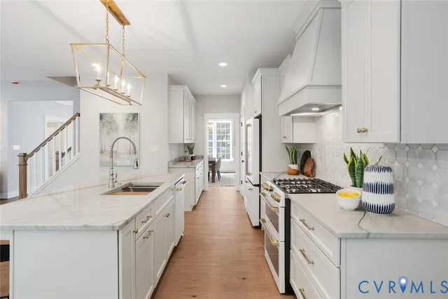 a kitchen with counter top space cabinets and appliances