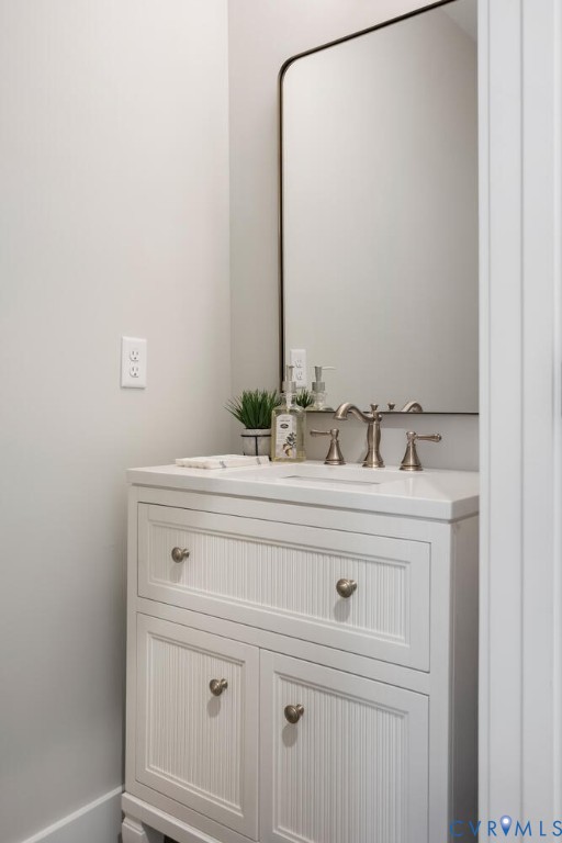 13800 Summerlook Lane Chesterfield, VA 23832 - Photo 23 of 49 a bathroom with a sink and a mirror